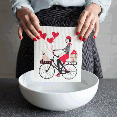 Sponge cloth absorbing water in bowl GIF
